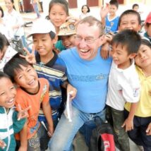 A global builders volunteers makes a few friends in Thailand